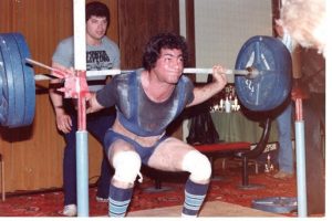 man squatting